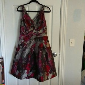 Cocktail fit and flair sleeveless dress with V-shaped and zipper in back